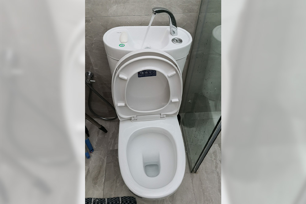 The eco flush toilet maximises water efficiency as water can be used twice. (Photo by Wong Twee Hee)