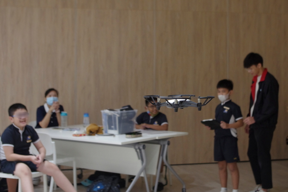 The children tried their hands at drone-flying as part of an activity conducted by external facilitators. (Photo by Cheng Kwong Ghee)